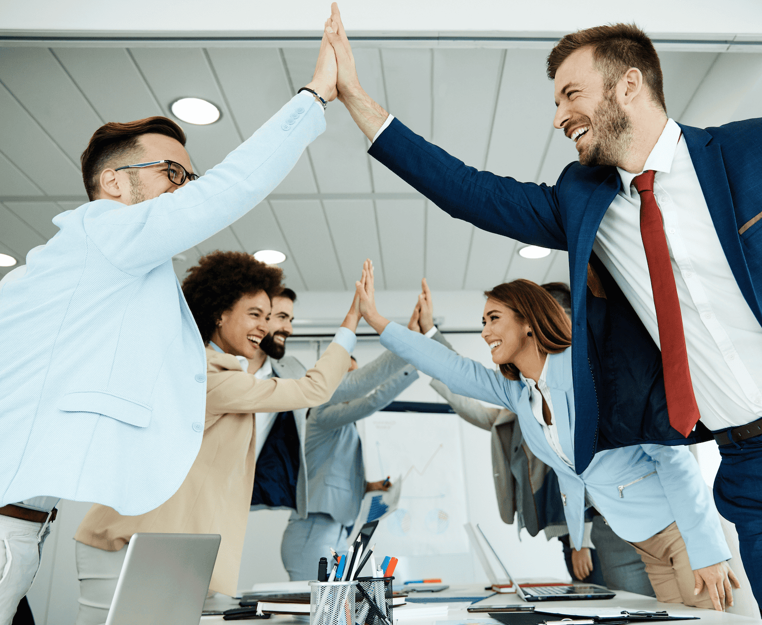 High fives at a business meeting